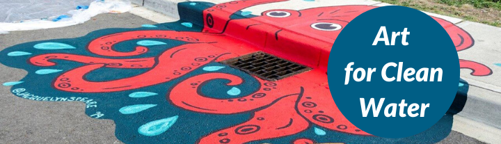 A storm drain that is painted with a giant red octopus and swimming in clean blue water