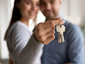 a couple with keys to the house.